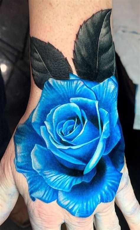 blue rose hand tattoo